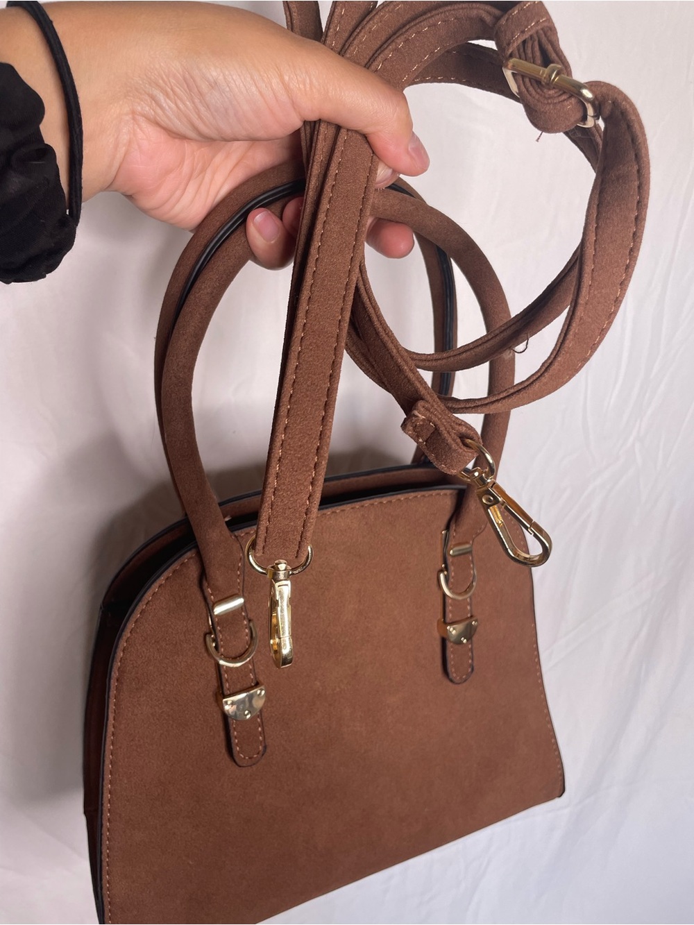 Brown suede handbag with gold hardware